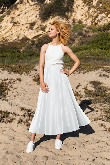 Beautiful woman in tank top and maxi skirt simple summer fashion full body shoot