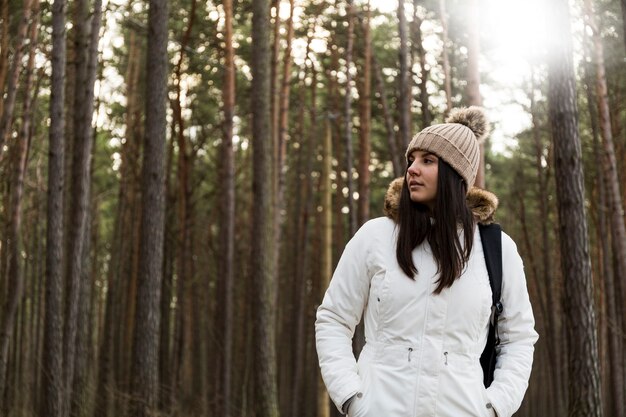 Beautiful woman walking in forest