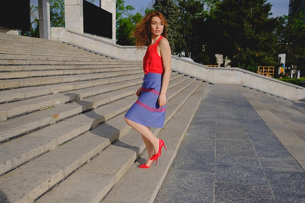 Beautiful woman walking up stairs