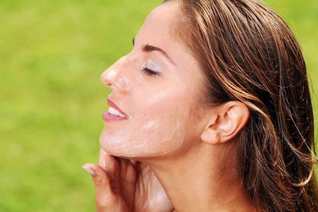 Beautiful woman washing her face