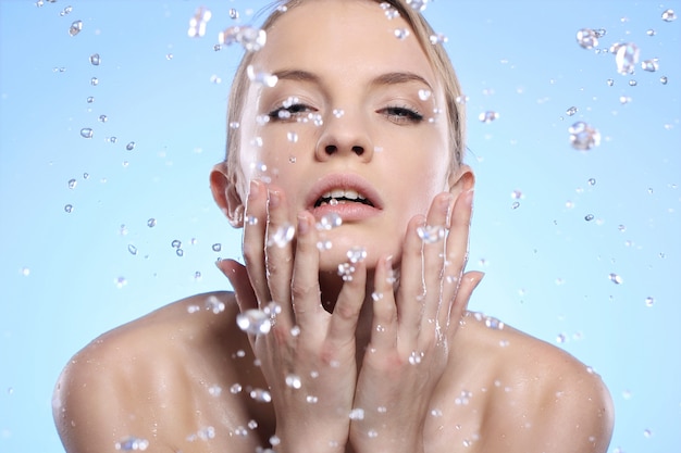 Beautiful woman washing her face