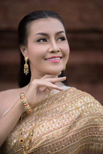 Beautiful Woman wearing typical Thai dress