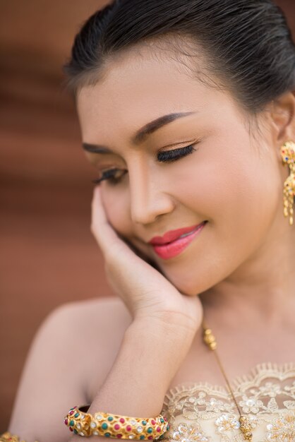 Beautiful Woman wearing typical Thai dress