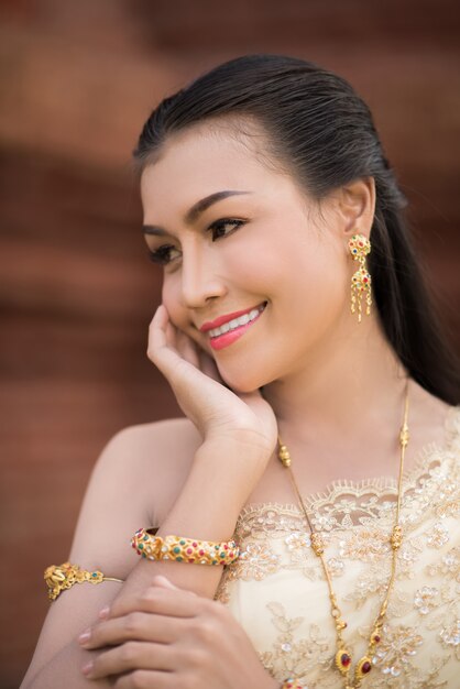 Beautiful Woman wearing typical Thai dress