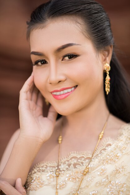 Beautiful Woman wearing typical Thai dress