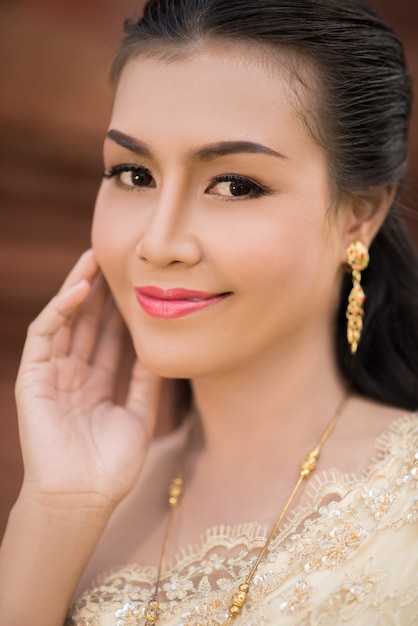 Beautiful Woman wearing typical Thai dress