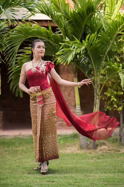 Beautiful Woman wearing typical Thai dress