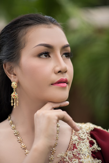 Free photo beautiful woman wearing typical thai dress