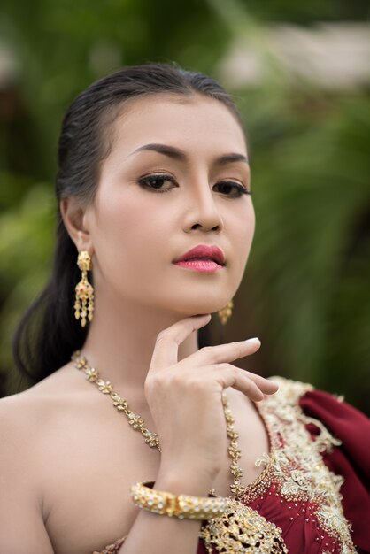 Beautiful Woman wearing typical Thai dress