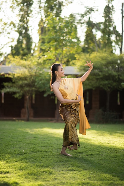 Free photo beautiful woman wearing typical thai dress