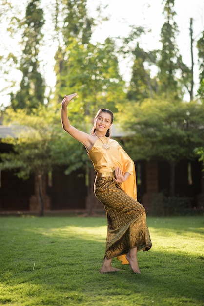 Free photo beautiful woman wearing typical thai dress