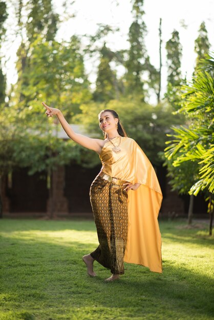 Beautiful Woman wearing typical Thai dress