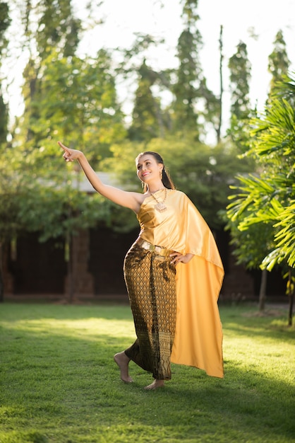 Beautiful Woman wearing typical Thai dress