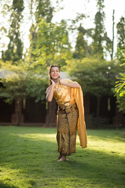 Free photo beautiful woman wearing typical thai dress