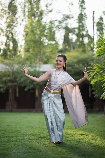 Beautiful Woman wearing typical Thai dress