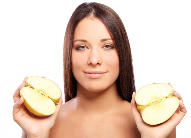 Beautiful woman with apple in hands