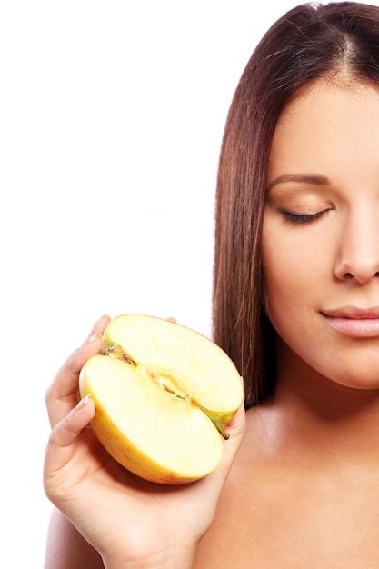 Beautiful woman with apple in hands