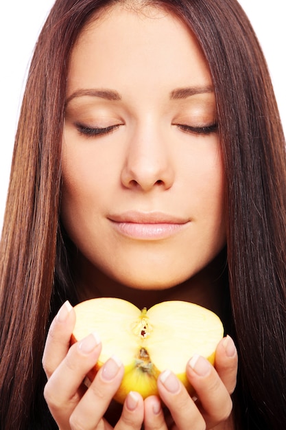 Beautiful woman with apple in hands