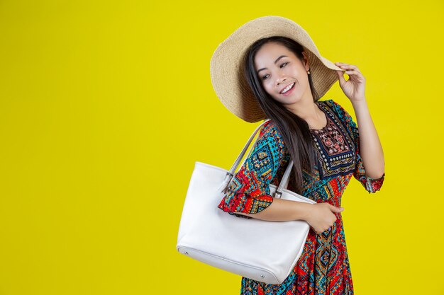 Beautiful woman with a bag In the yellow