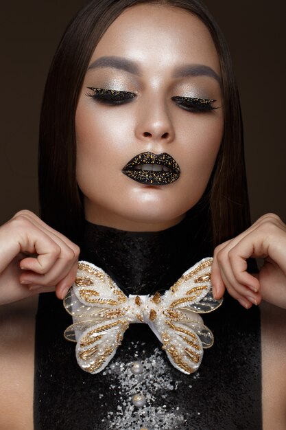 Premium Photo Beautiful Woman With Black Creative Art Make Up And Gold Accessories