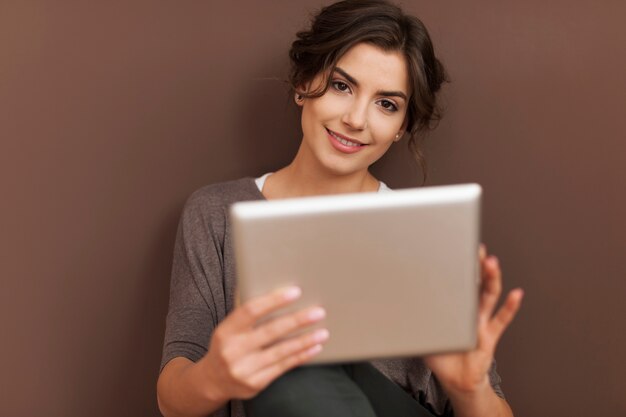 Beautiful woman with contemporary digital tablet