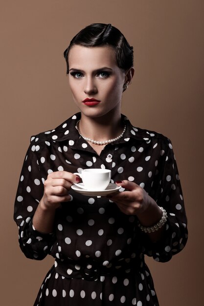 Beautiful woman with cup of coffee