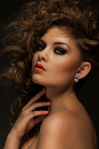 Free photo beautiful woman with curls and makeup