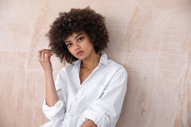 Beautiful woman with curly hair posing