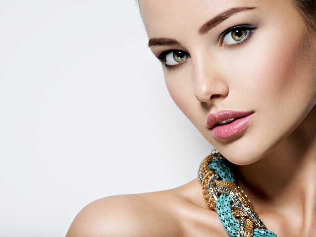 beautiful woman with evening make-up jewelry and beauty fashion photo