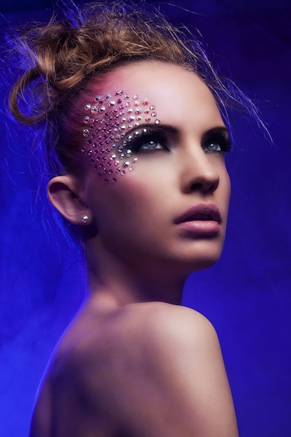 Free photo beautiful woman with fantasy makeup