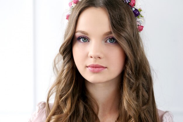 Beautiful woman with flowers at head