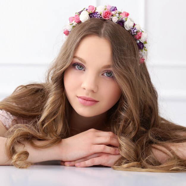 Beautiful woman with flowers at head