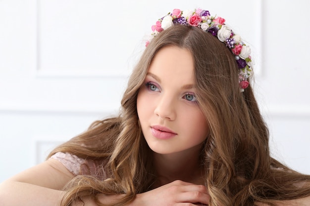 Beautiful woman with flowers at head