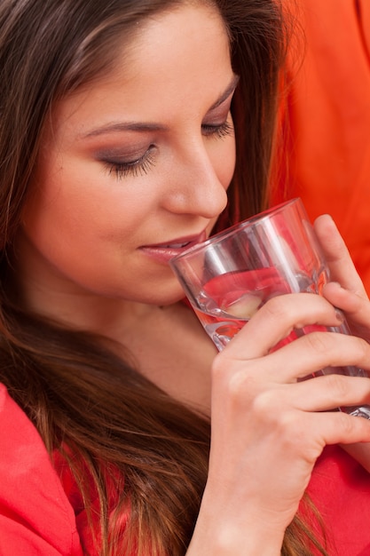 Beautiful woman with glass at home