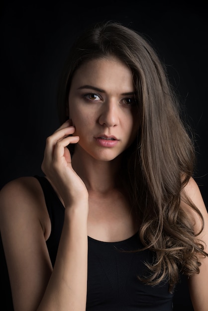 Beautiful woman with healthy body on black background