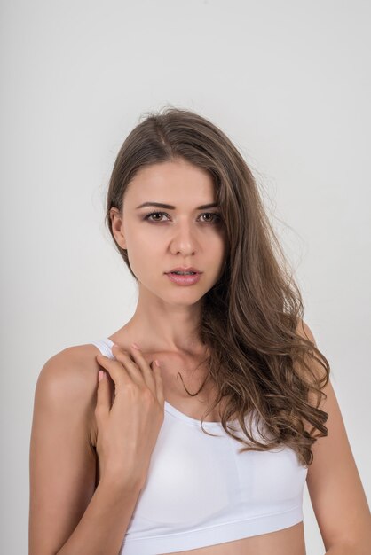 Beautiful woman with healthy body on white background