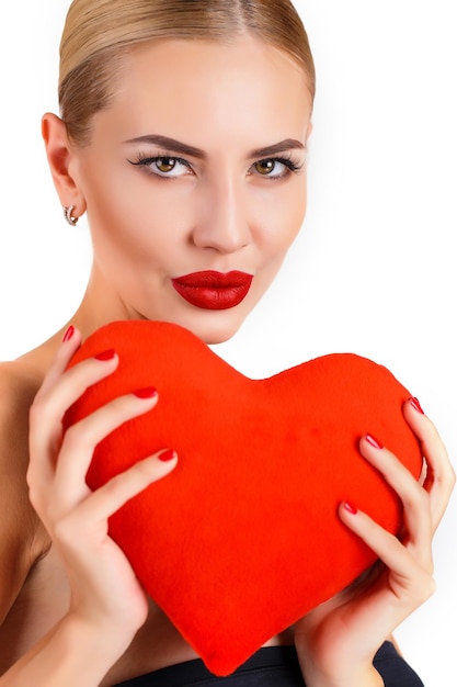 beautiful woman with a heart indoor isolated