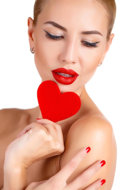 beautiful woman with a heart indoor isolated