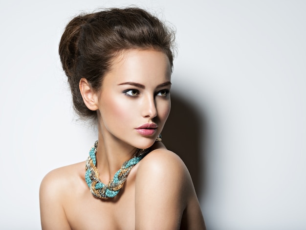 Free photo beautiful woman with  make-up necklace and beauty fashion photo