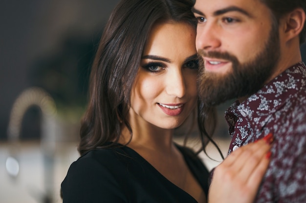 Beautiful woman with man posing at camera