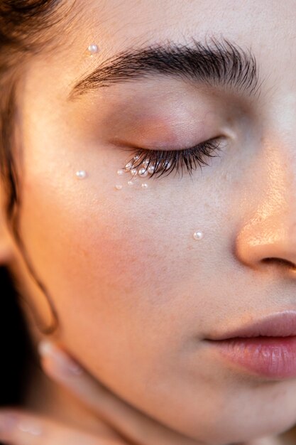 Beautiful woman with pearls make up