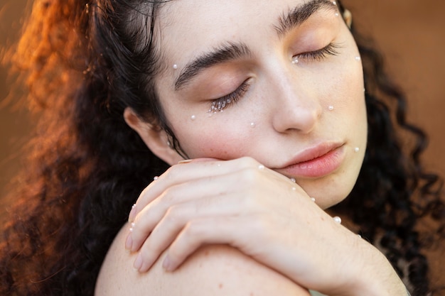 Beautiful woman with pearls make up