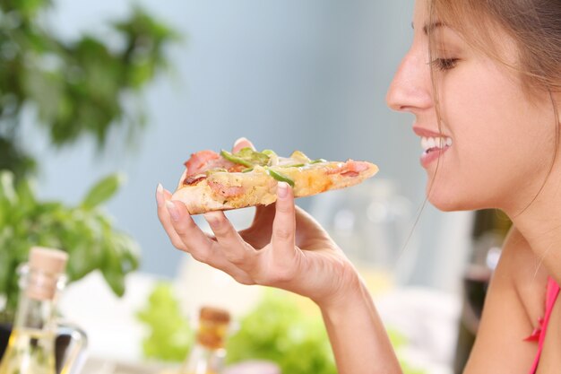 Beautiful woman with pizza