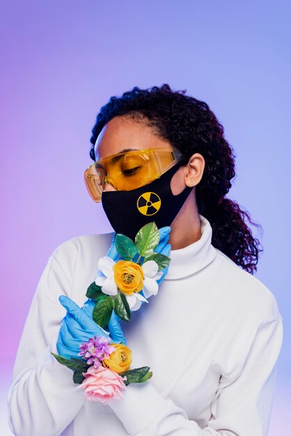 Beautiful woman with safety glasses and floral gloves