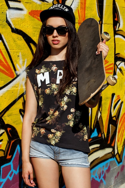 Free photo beautiful woman with skateboard