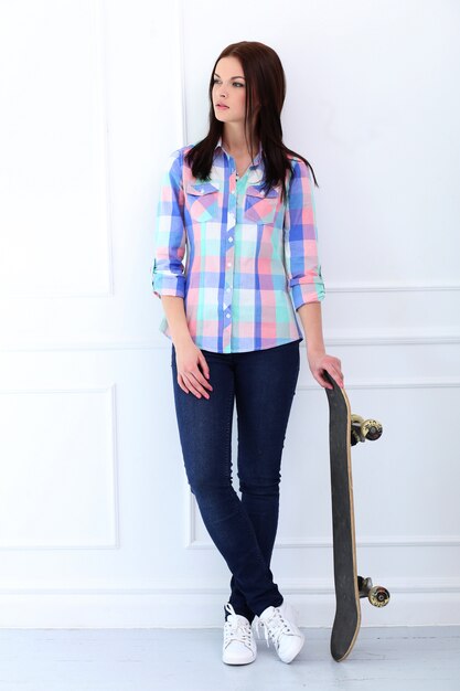 Beautiful woman with skateboard