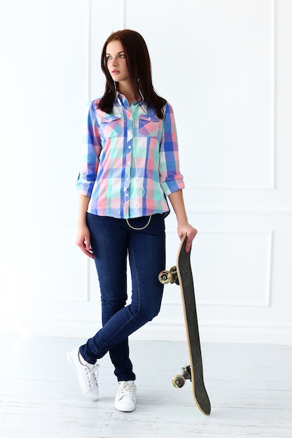 Beautiful woman with skateboard