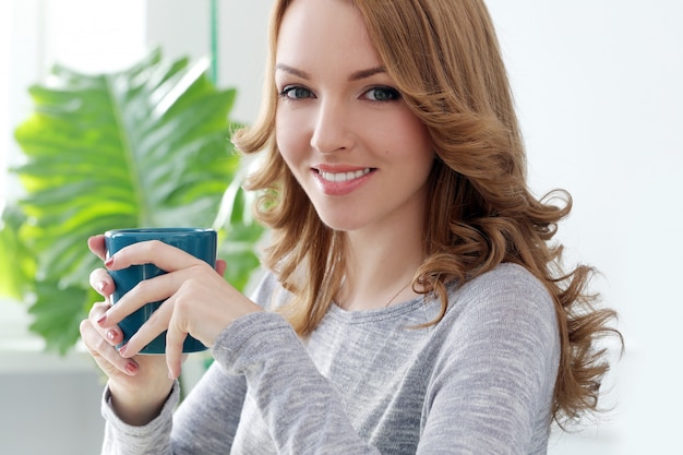 Beautiful woman with tea cup