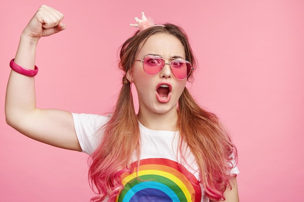 Beautiful woman with trendy pink sunglasses