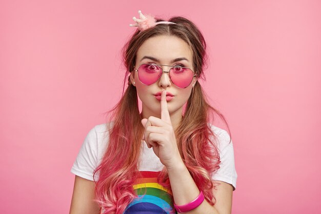 Beautiful woman with trendy pink sunglasses